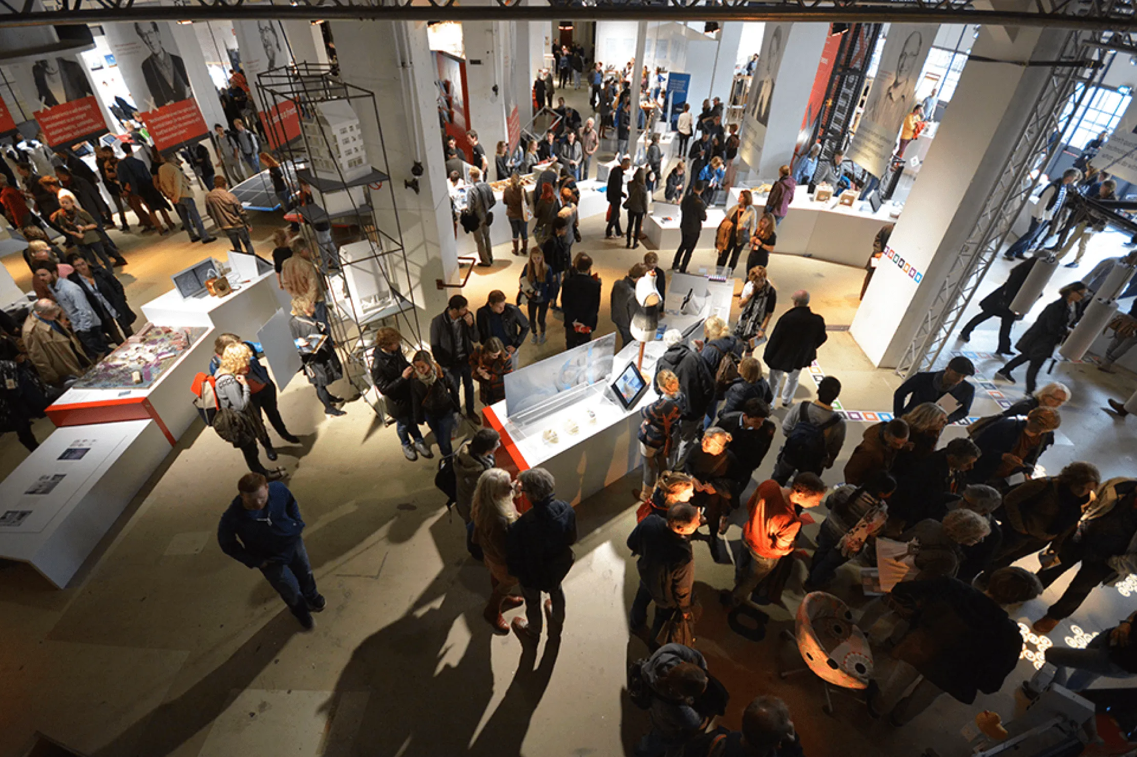Alumni walking through an exhibition during Dutch Design Week