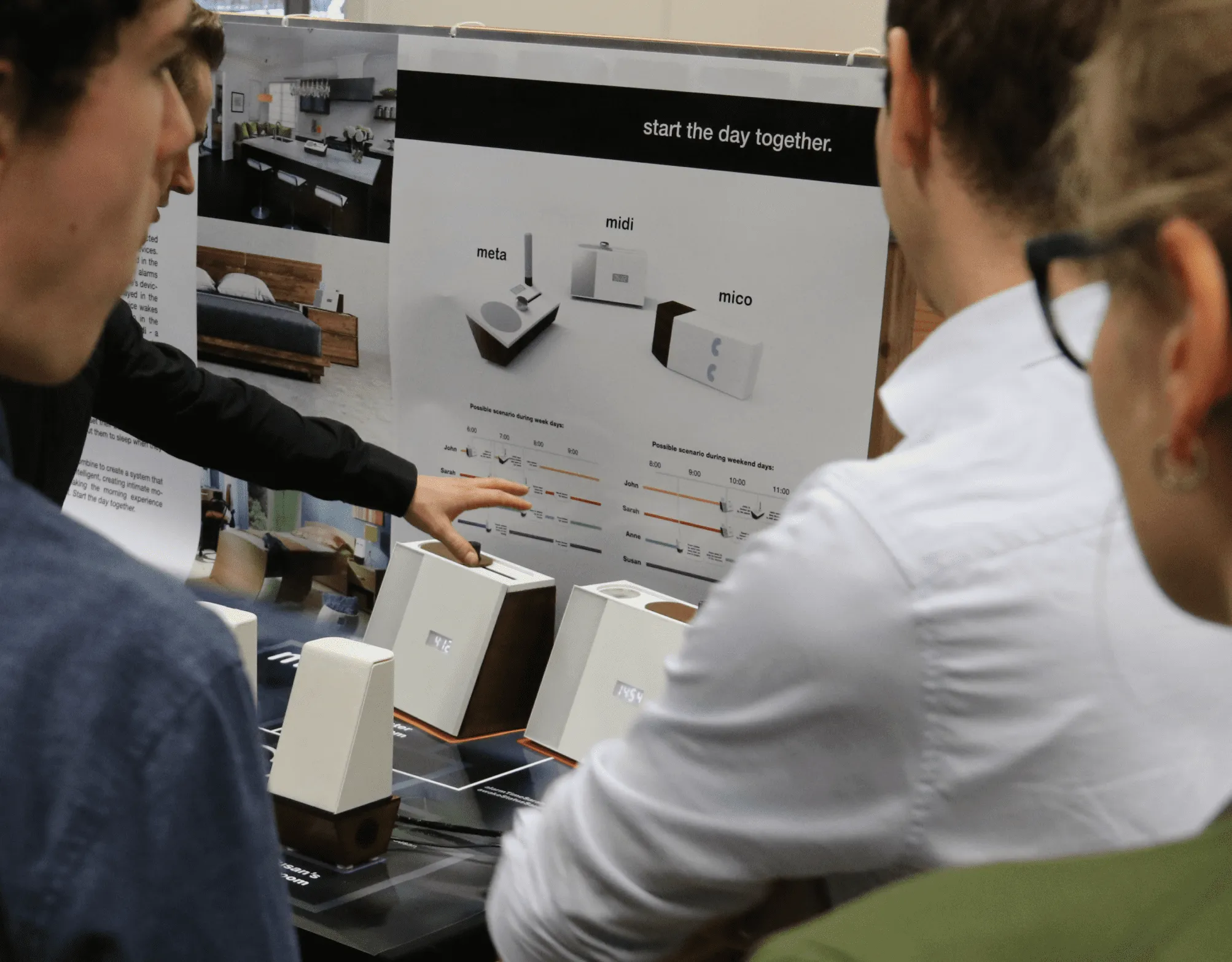 Alumni looking at student work during Demo Day